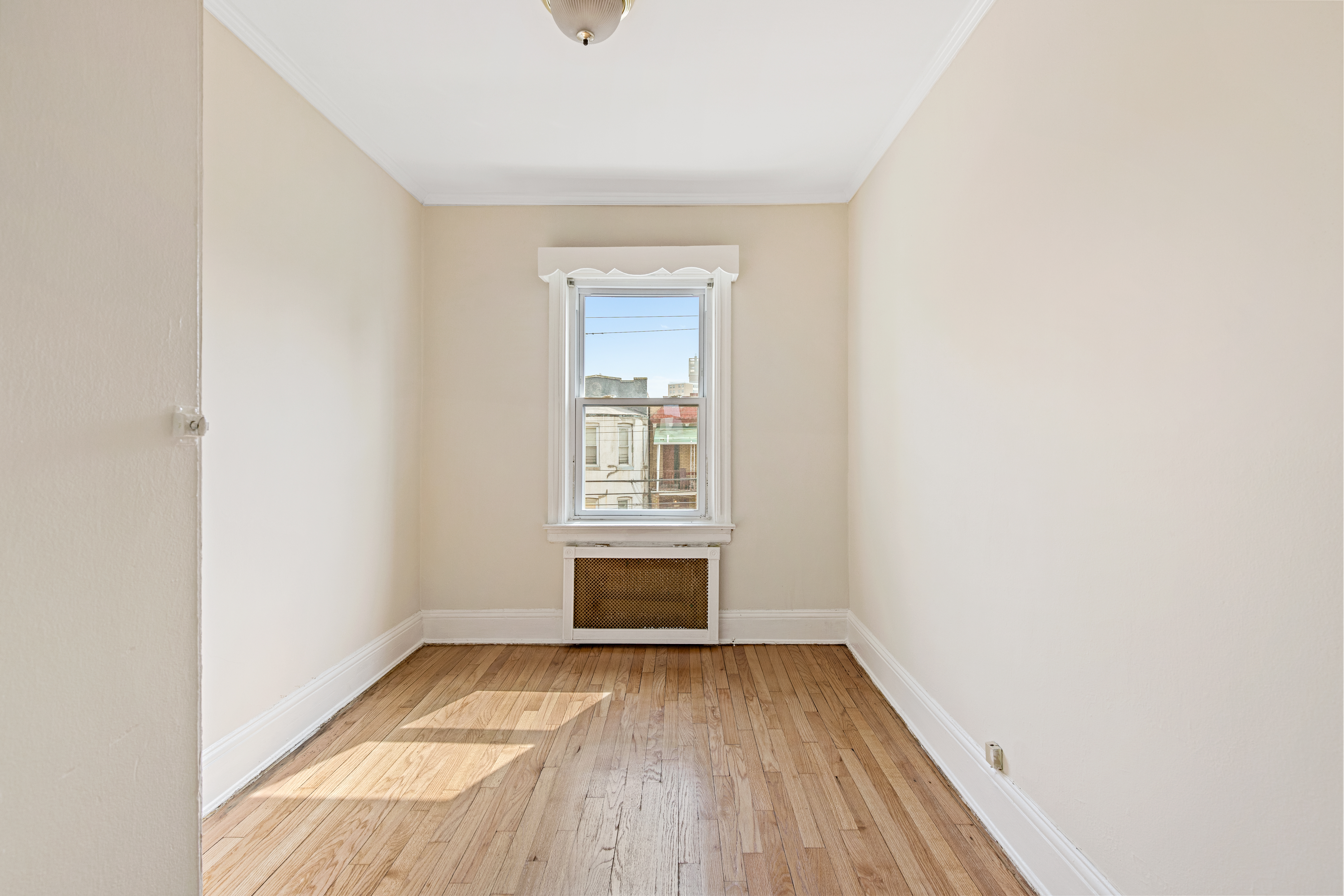 32 Tudor Terrace Brooklyn, NY 11224 - Photo 9 of 15 a view of empty room with wooden floor