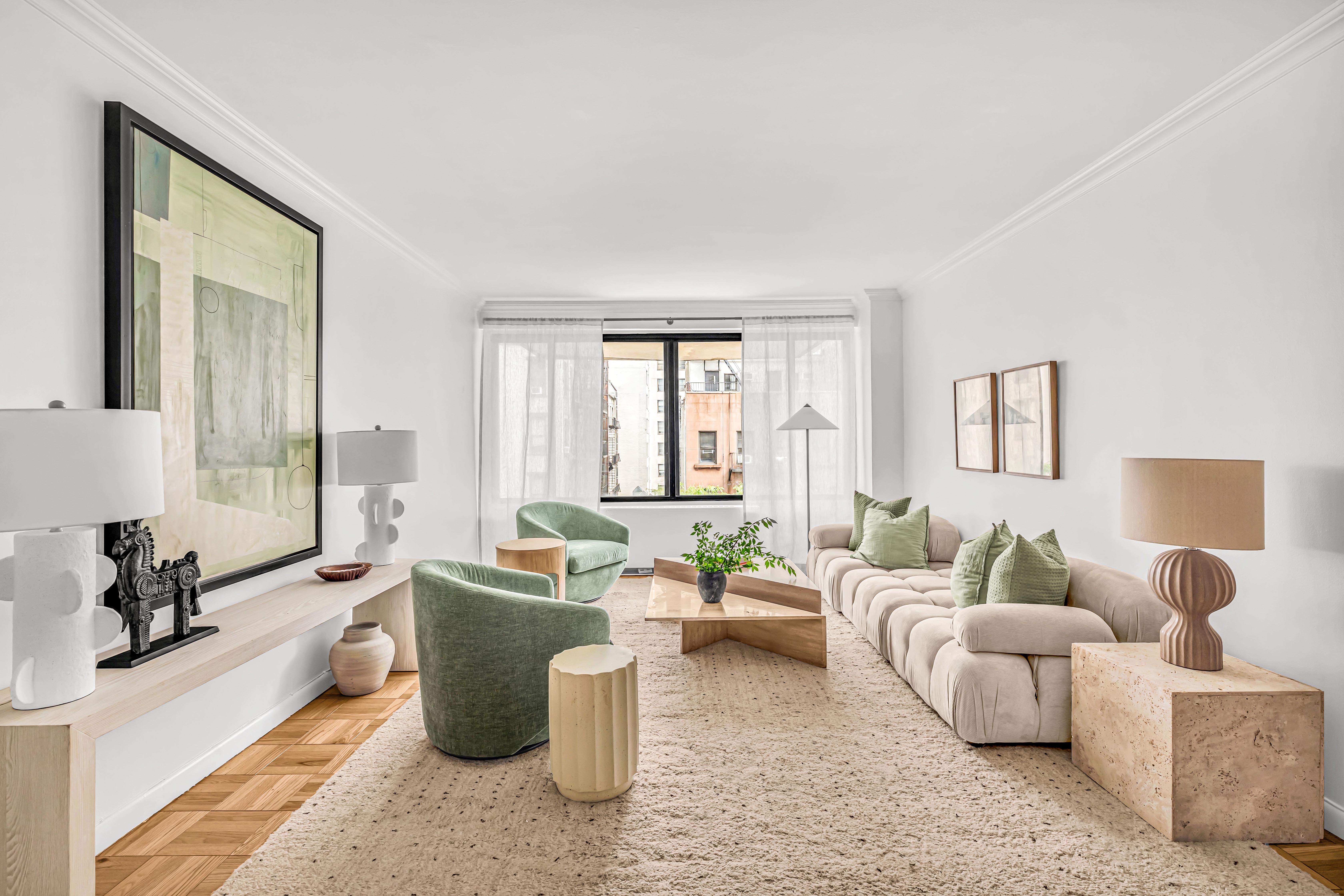 203 East 72nd Street, Unit 3E Manhattan, NY 10021 - Photo 1 of 6 a living room with furniture and a large window