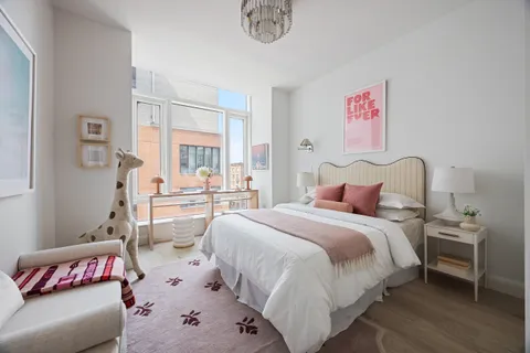 a bedroom with a bed and a couch