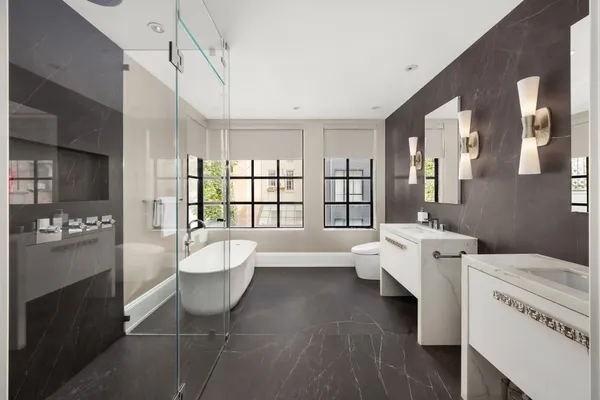 a bathroom with a bathtub and a shower