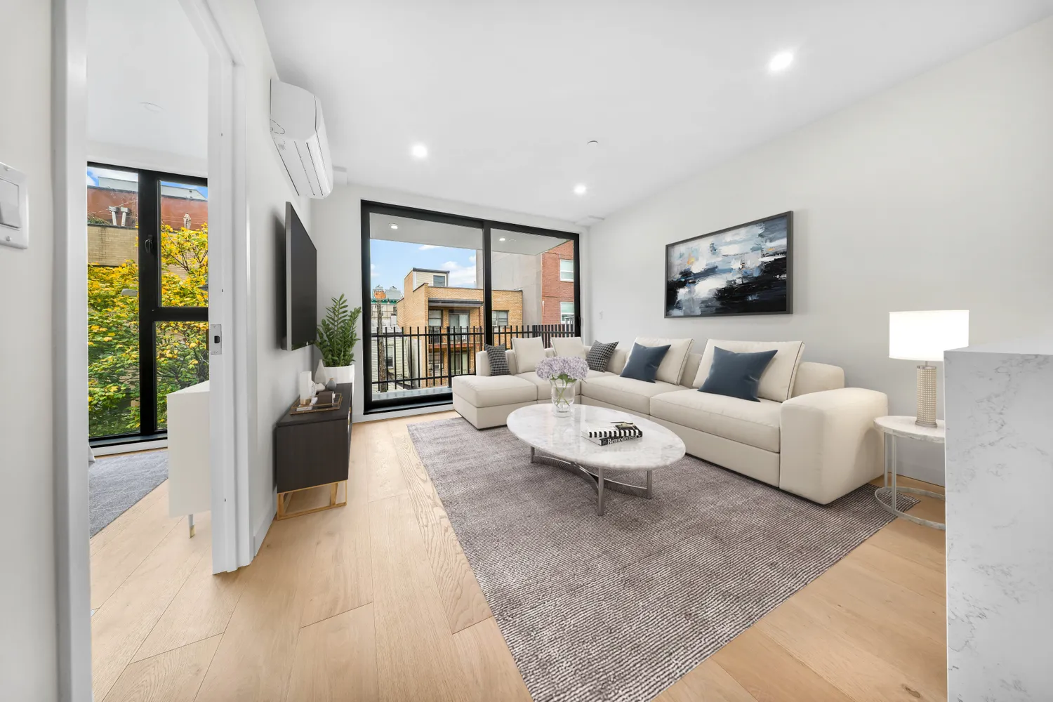 a living room with furniture and a flat screen tv