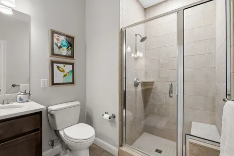 a bathroom with a toilet sink and shower