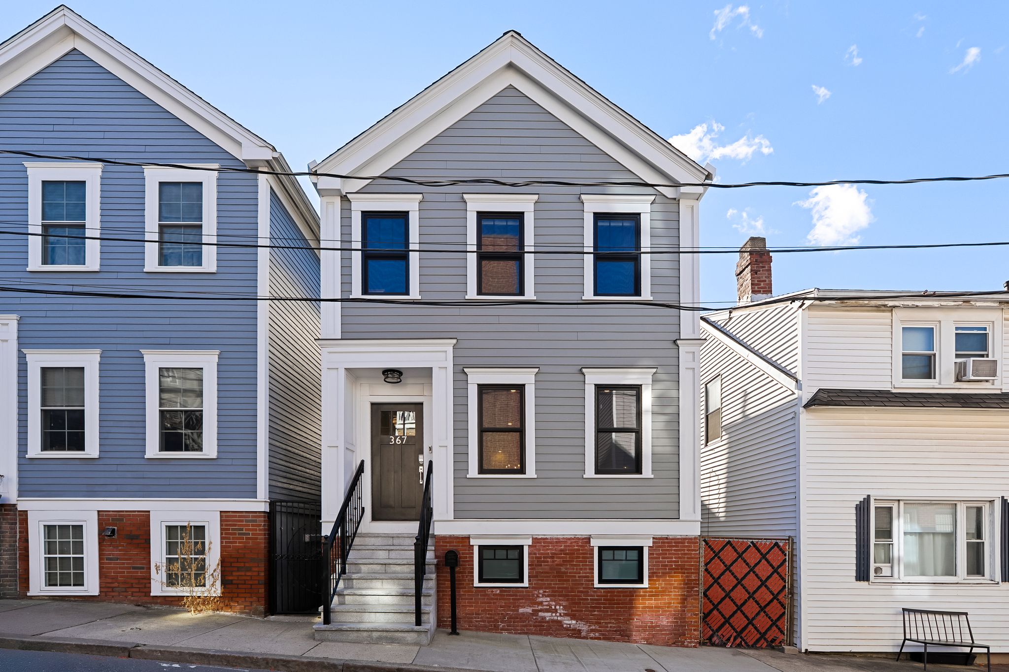 367 Silver Street South Boston, MA 02127 - Photo 1 of 9 a view of a brick house with many windows