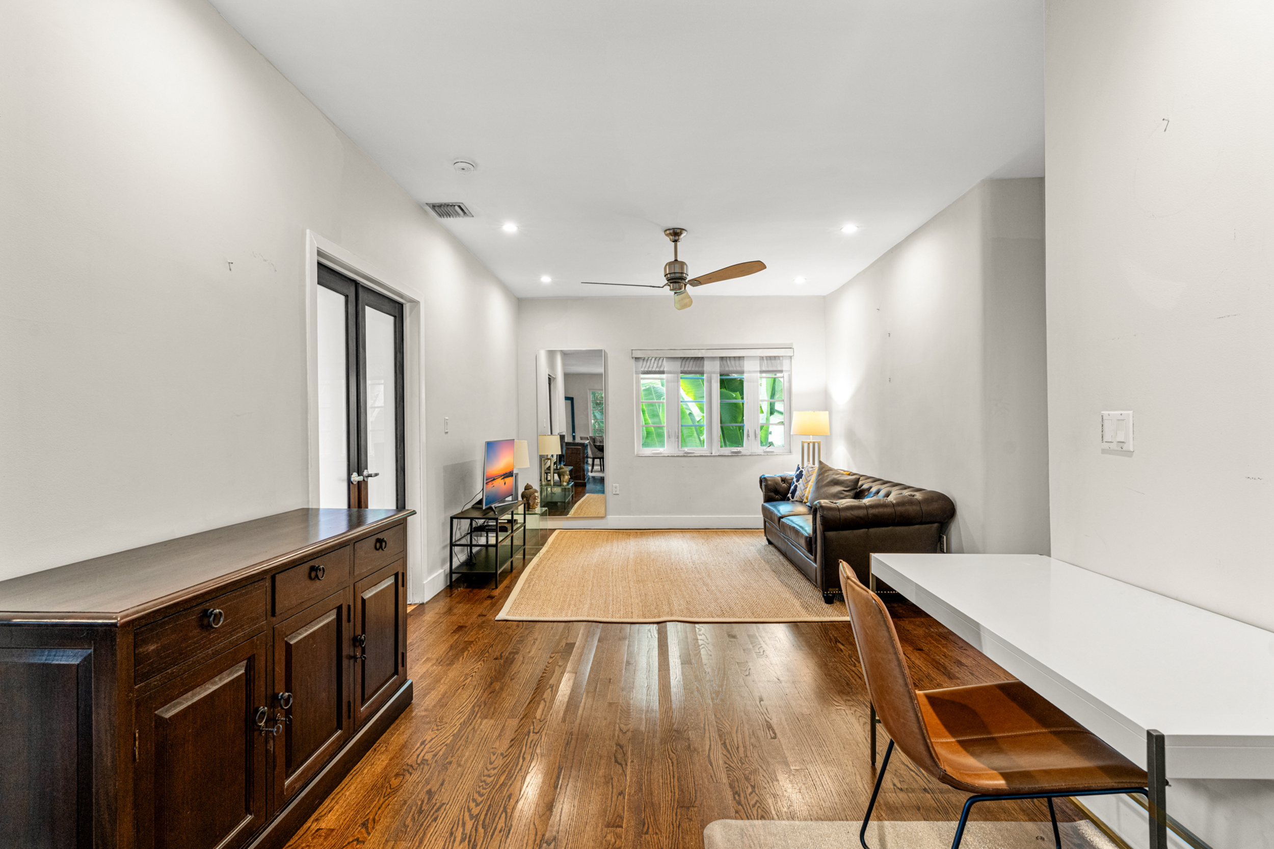 711 East 14th Street, Unit 7 Hialeah, FL 33010 - Photo 11 of 36 a living room with furniture and a wooden floor