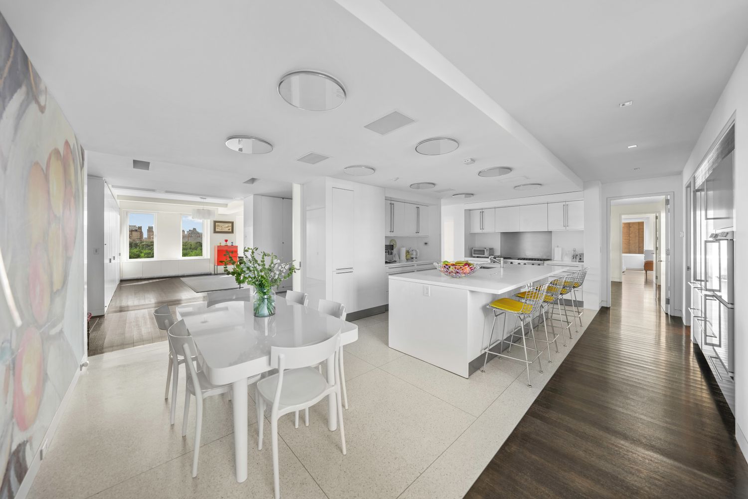 a living room with kitchen island furniture and a wooden floor