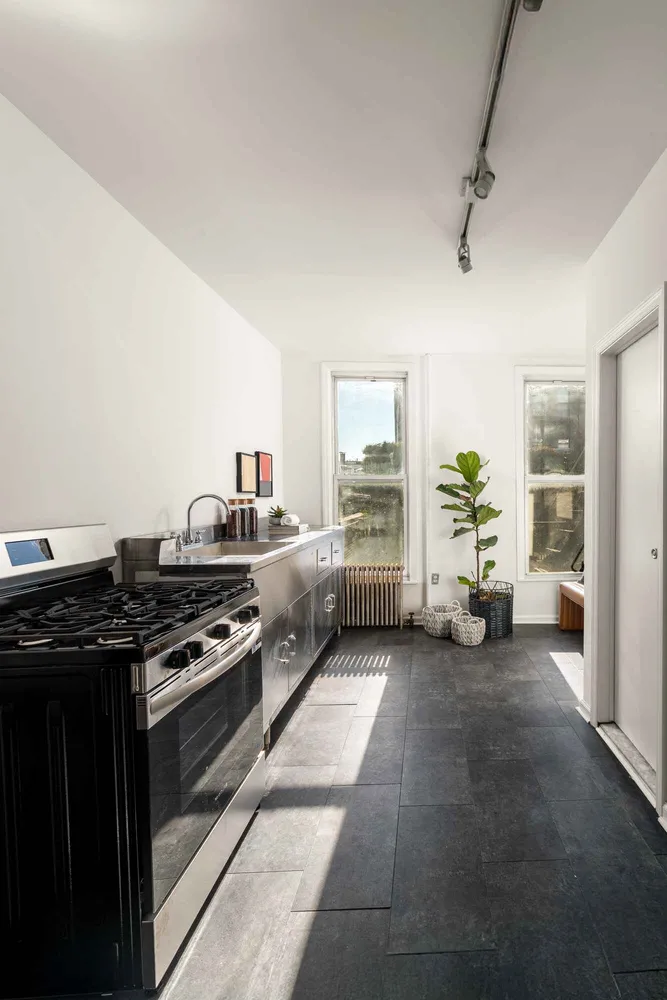 a view of a livingroom with a kitchen