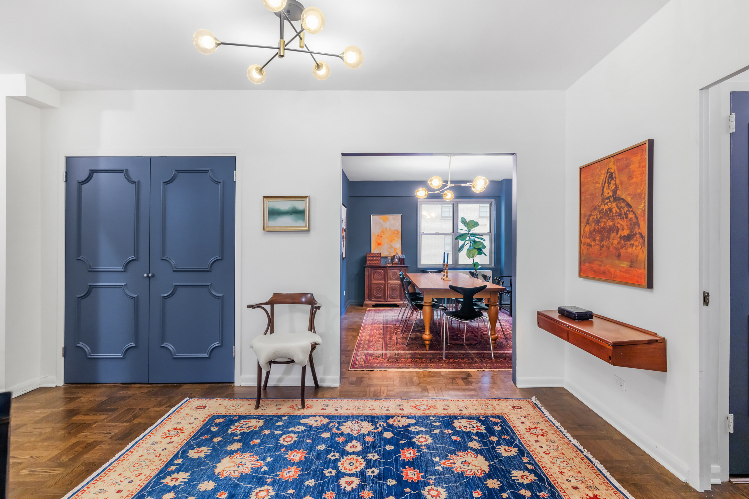 16 Sutton Place, Unit 11A Manhattan, NY 10022 - Photo 3 of 19 a living room with furniture and a rug