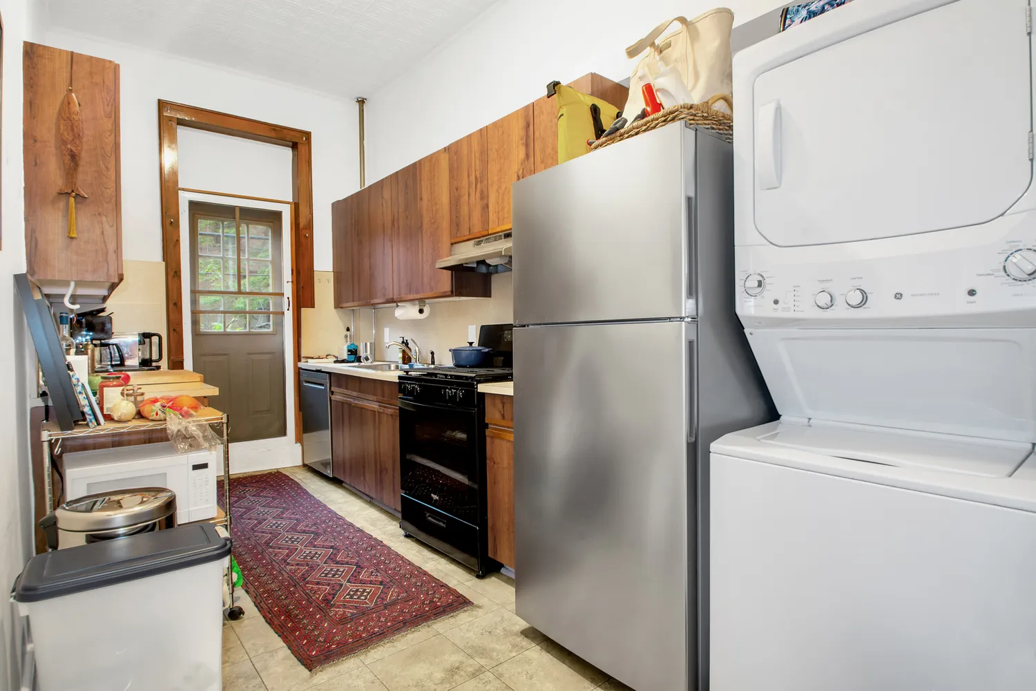 a kitchen with a refrigerator sink and stove