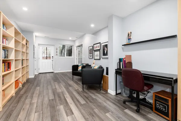 a view of a patio with couches and a potted plant on a table