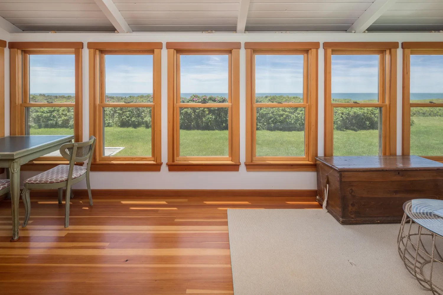 a bathroom with a large window and a bath tub