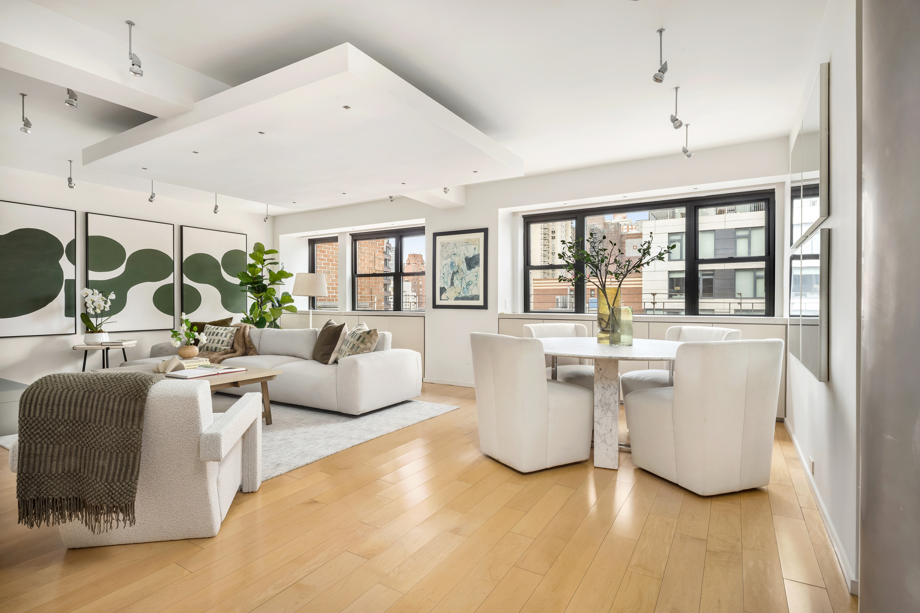 510 East 86th Street, Unit 17C Manhattan, NY 10028 - Photo 16 of 31 a living room with furniture and a large window
