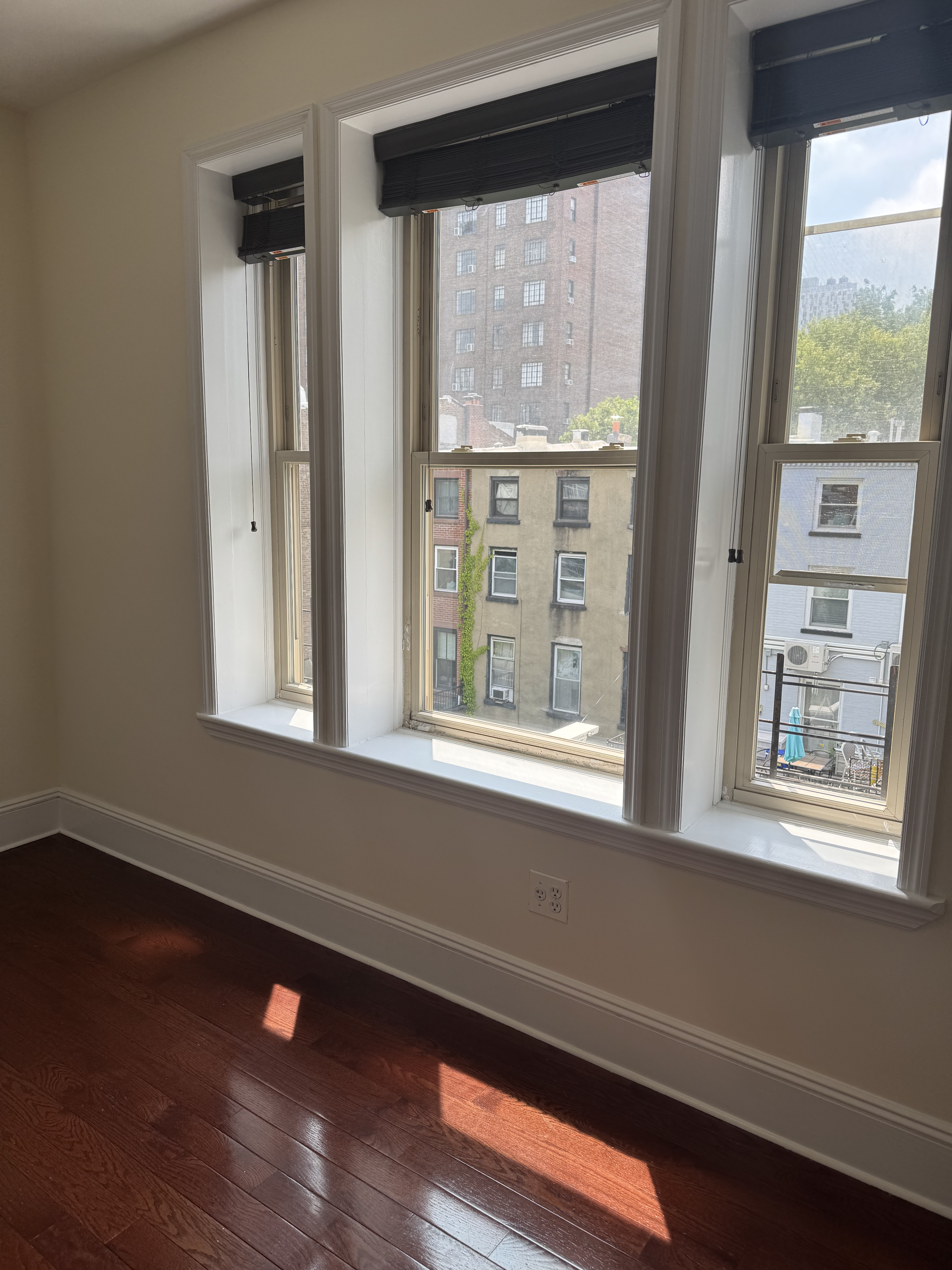 260 Cumberland Street, Unit 15 Brooklyn, NY 11205 - Photo 4 of 10 a view of a small space with wooden floor and a window