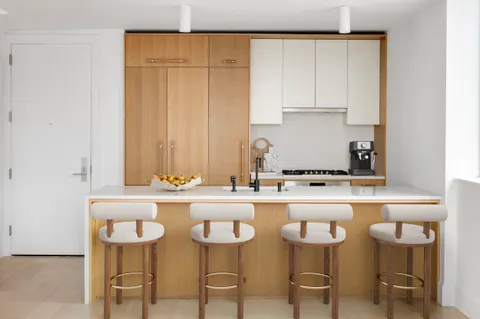 a kitchen with a table and chairs in it