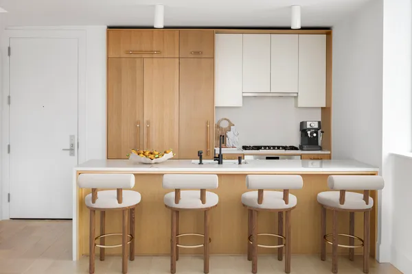 a kitchen with a table and chairs in it
