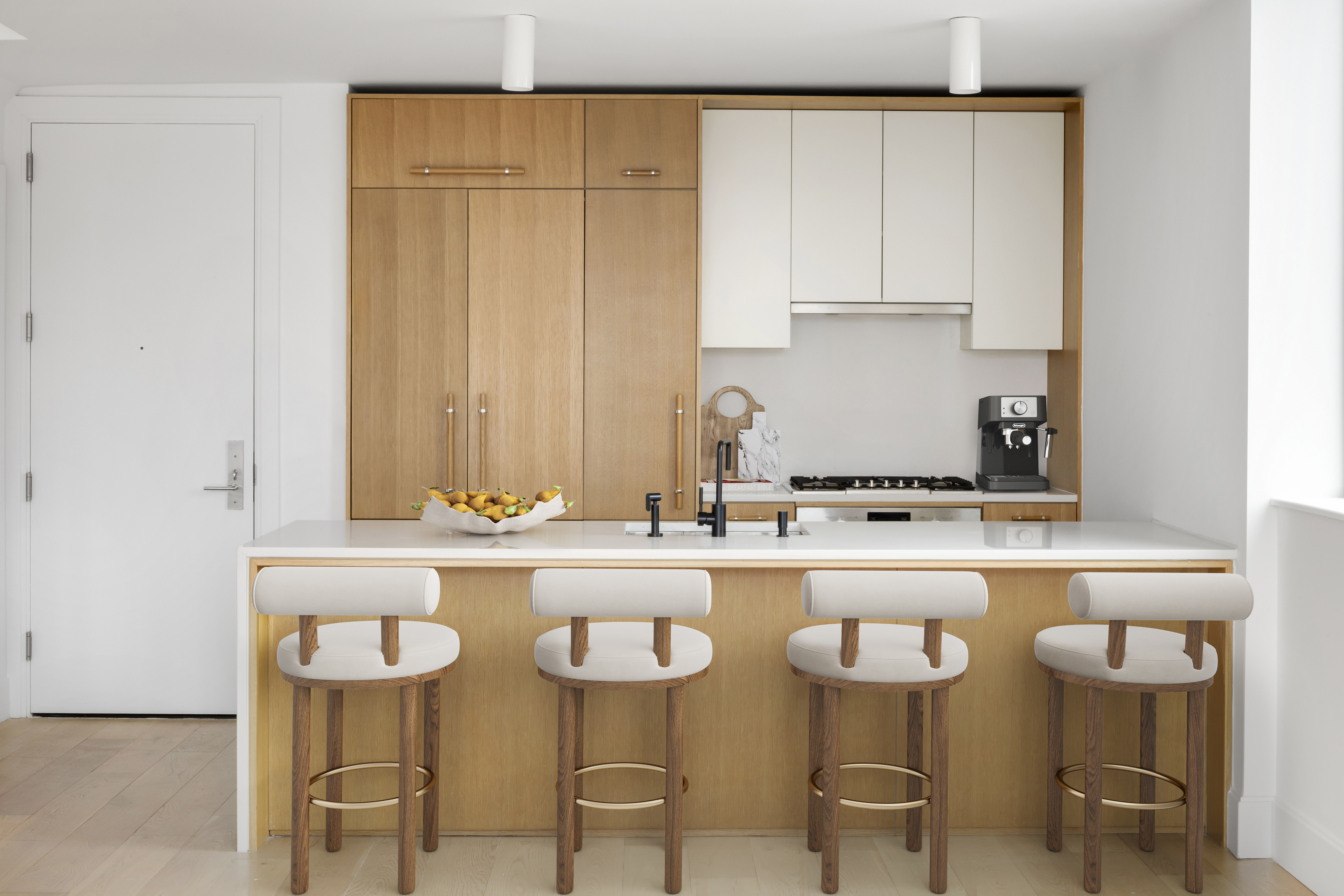 a kitchen with a table and chairs in it