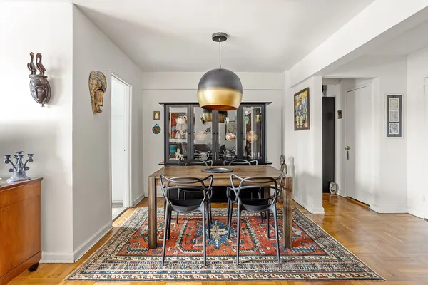 a view of a livingroom with furniture window and wooden floor