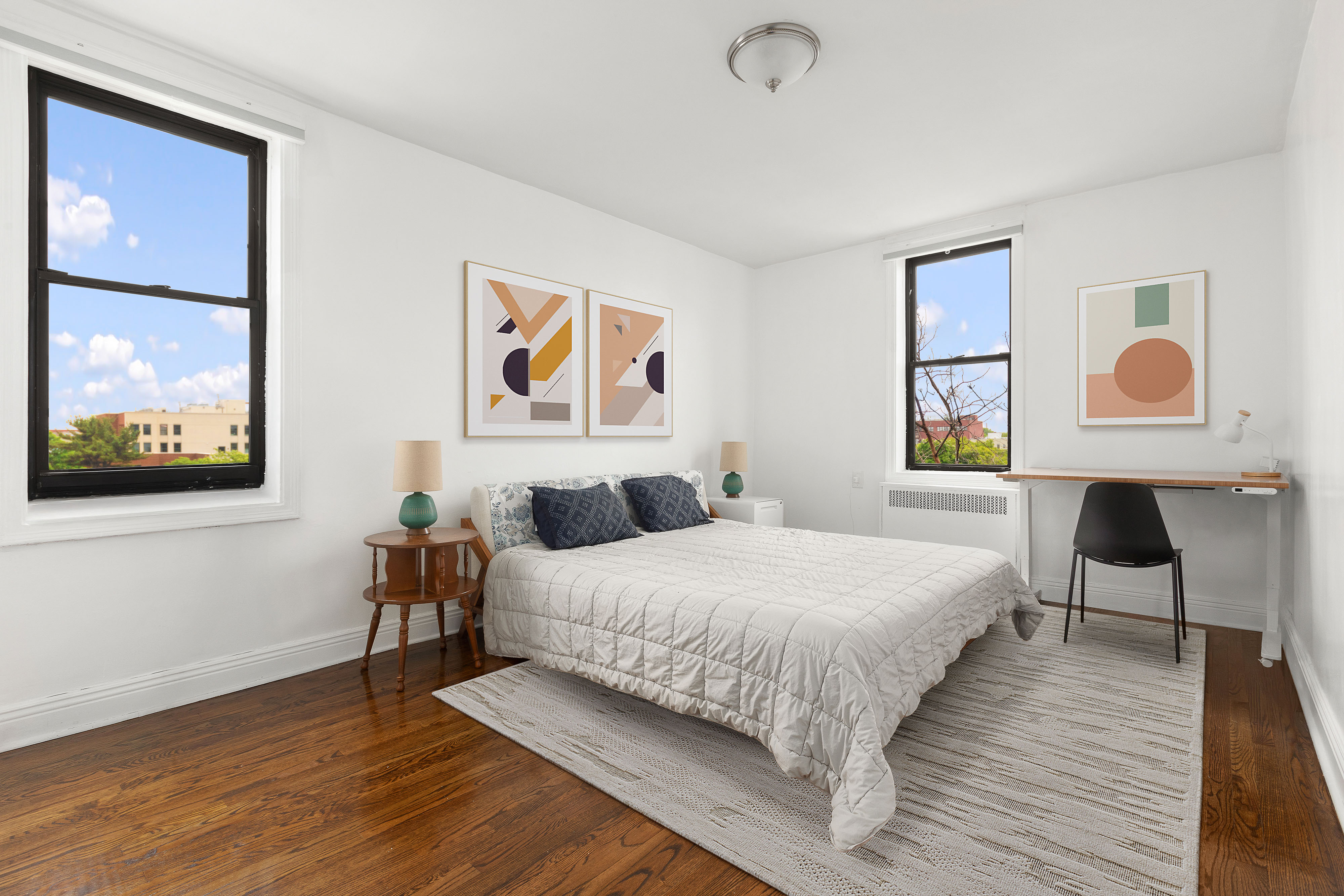 960 Sterling Place, Unit 6J Brooklyn, NY 11213 - Photo 6 of 11 a bedroom with a bed and wooden floor