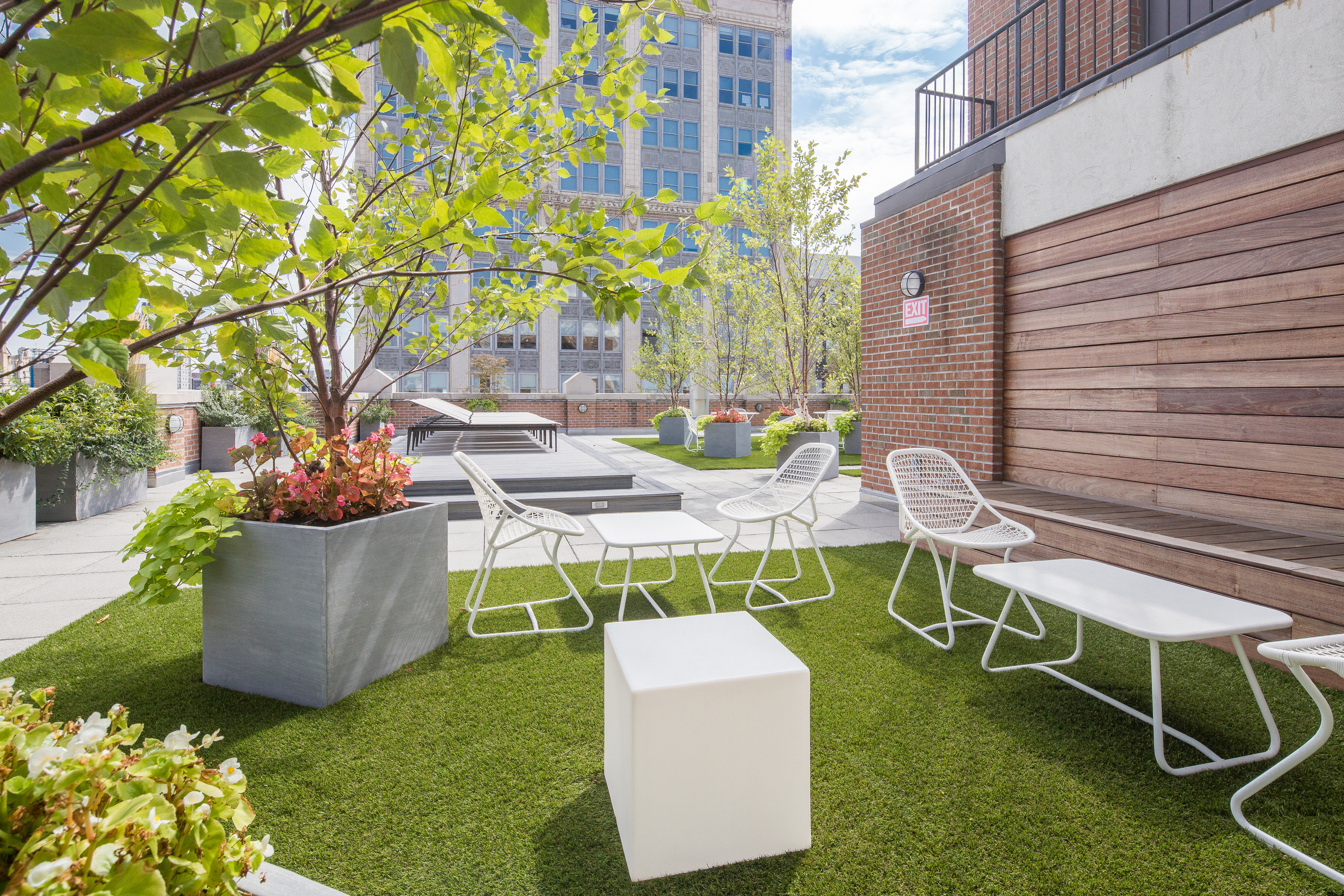 260 Park Avenue South, Unit 12F Manhattan, NY 10010 - Photo 7 of 9 a view of a patio with table and chairs and potted plants