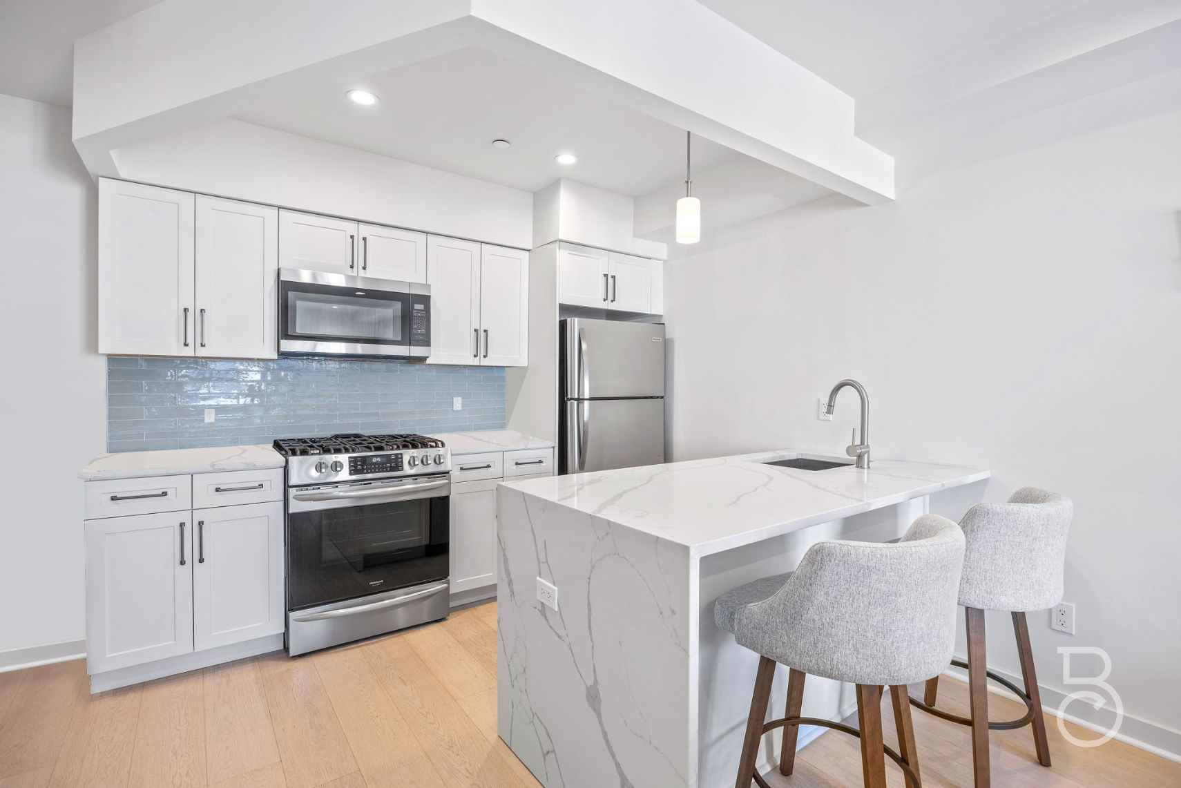25-74 34th Street, Unit 4C Queens, NY 11103 - Photo 1 of 15 a kitchen with stainless steel appliances a stove a sink island and a refrigerator