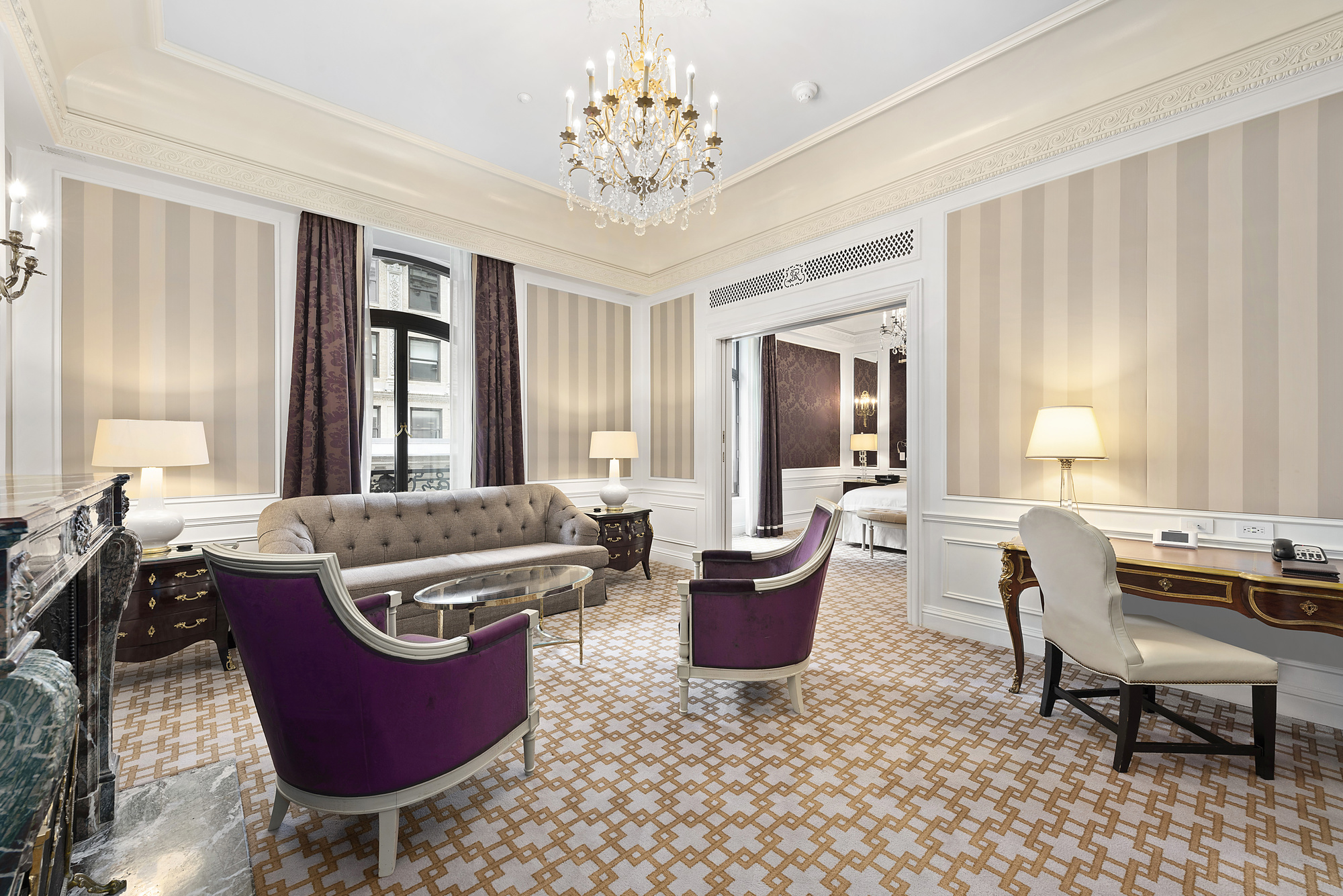 2 East 55th Street, Unit 907W20 Manhattan, NY 10022 - Photo 2 of 11 a living room with furniture windows and a chandelier