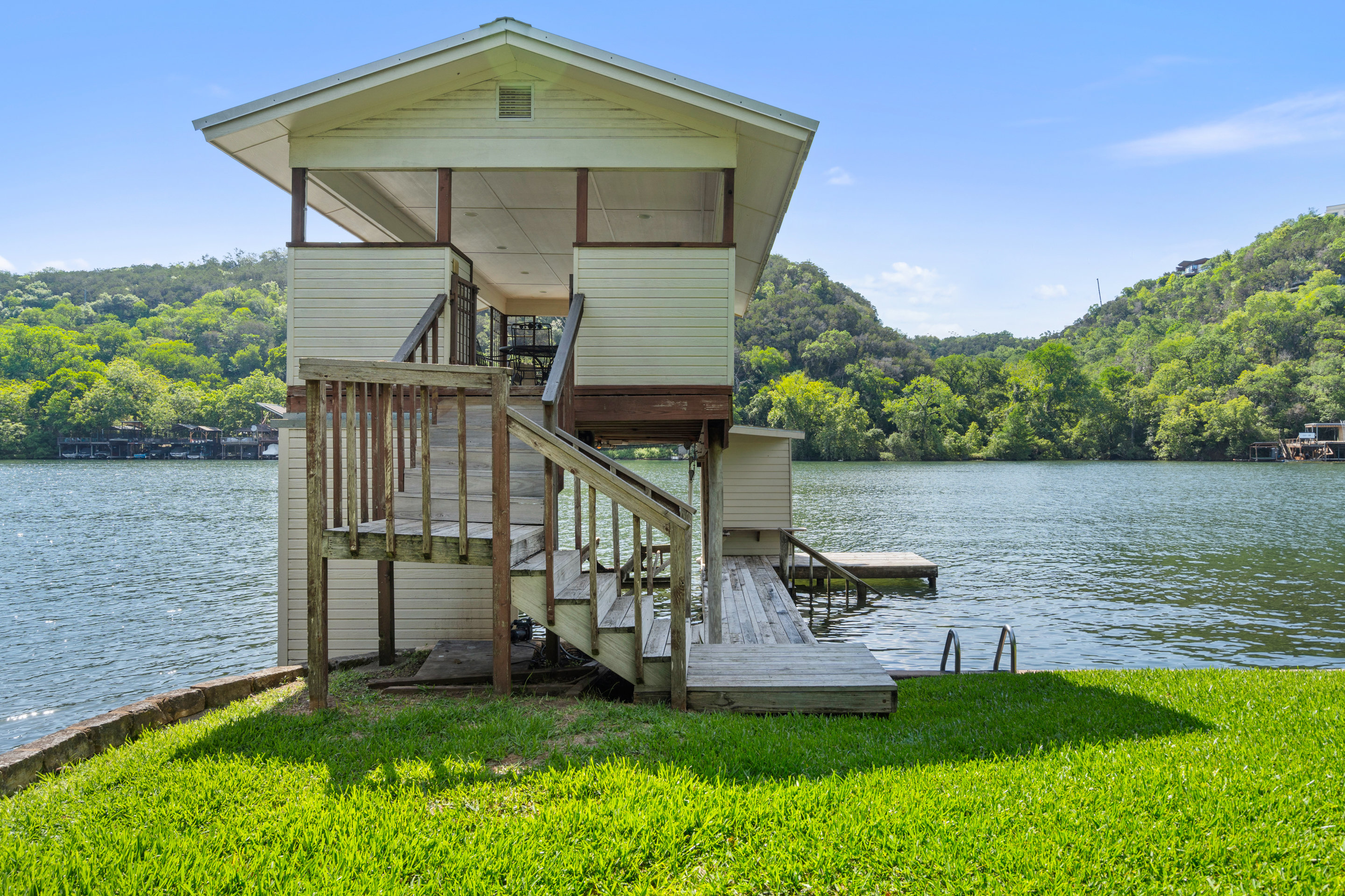 2603 Pearce Road Austin, TX 78730 - Photo 39 of 41 a view of a house with a yard from a lake view
