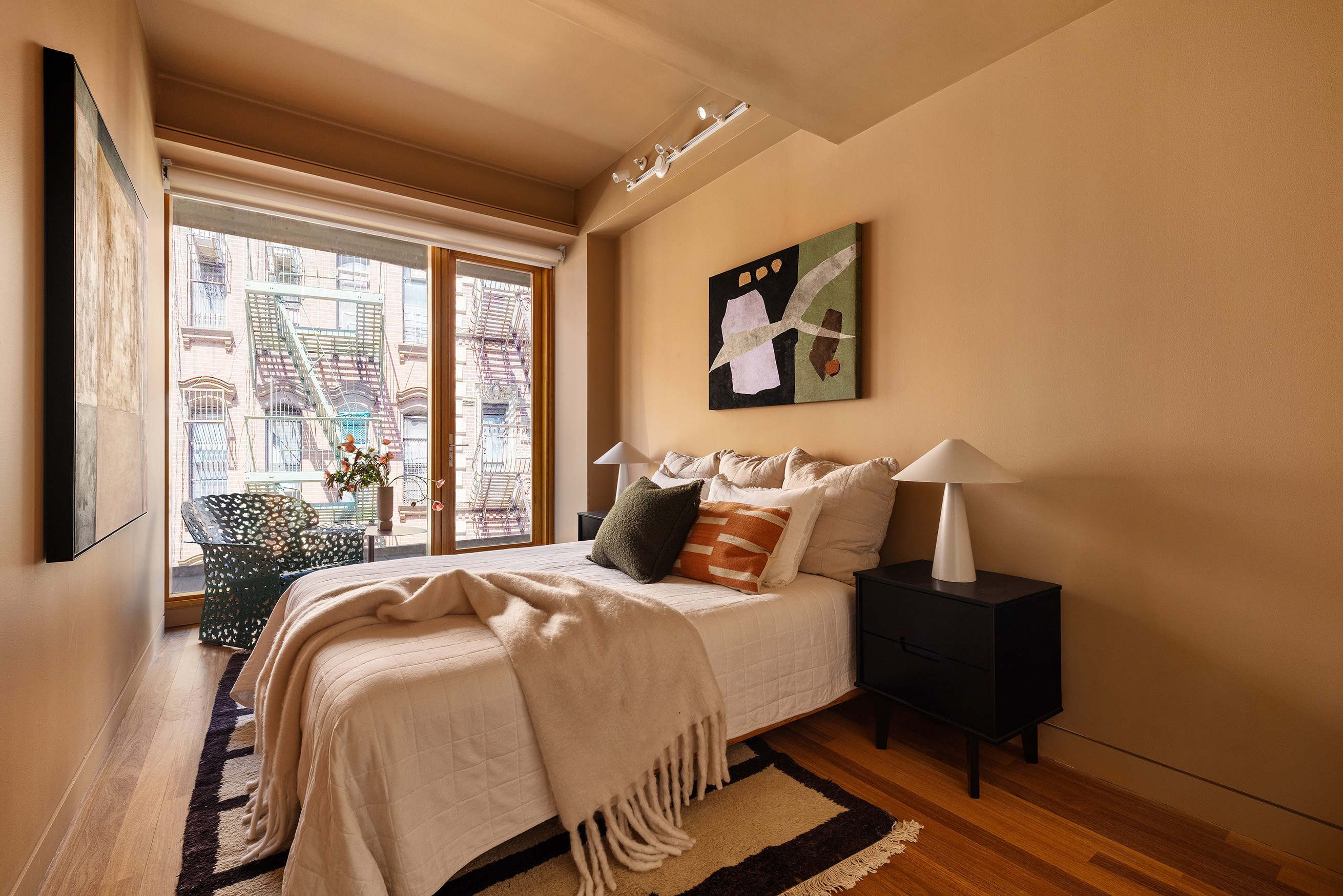 30 Orchard Street, Unit 2 Manhattan, NY 10002 - Photo 7 of 11 a bed sitting in a bedroom next to a window