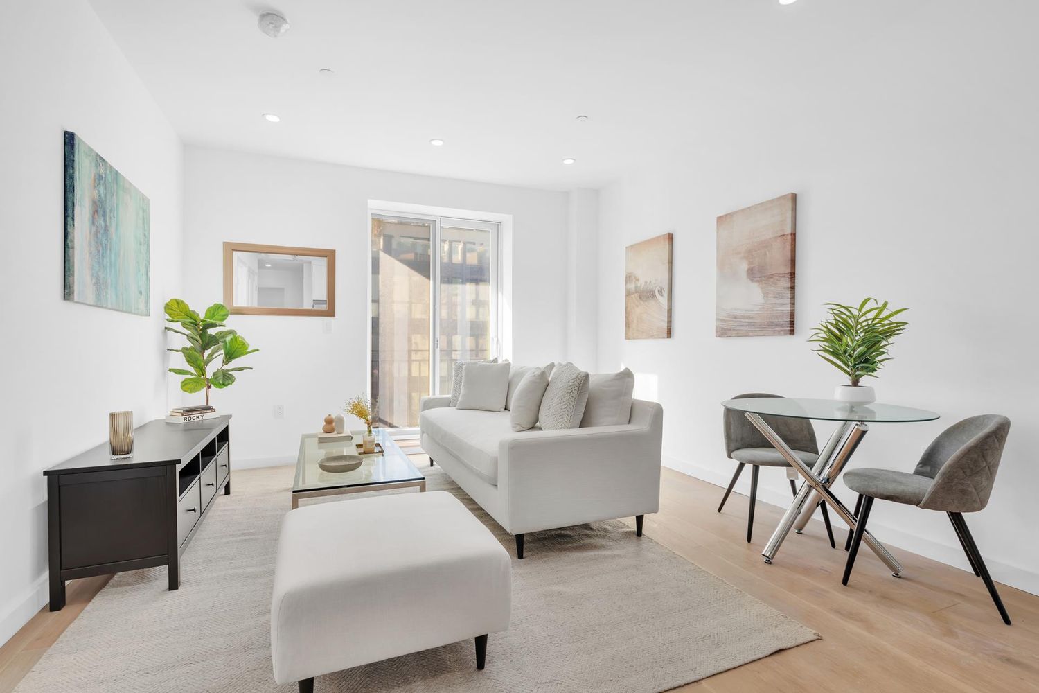 250 Manhattan Avenue, Unit 3F Brooklyn, NY 11211 - Photo 1 of 7 a living room with furniture and a potted plant