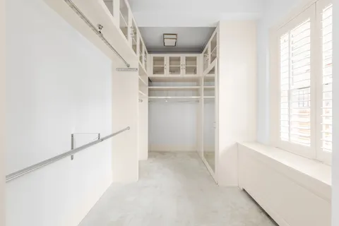 a view of walk in closet with window