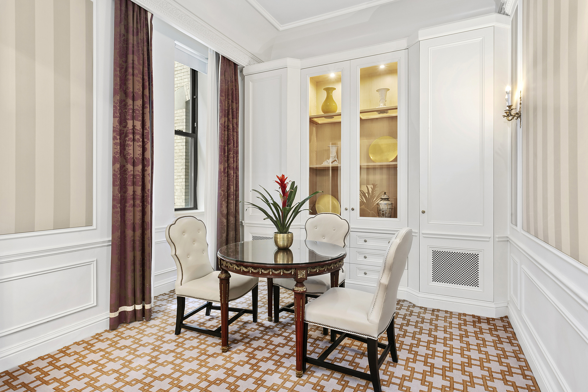 2 East 55th Street, Unit 822W24 Manhattan, NY 10022 - Photo 2 of 11 a view of a dining room with furniture and a window