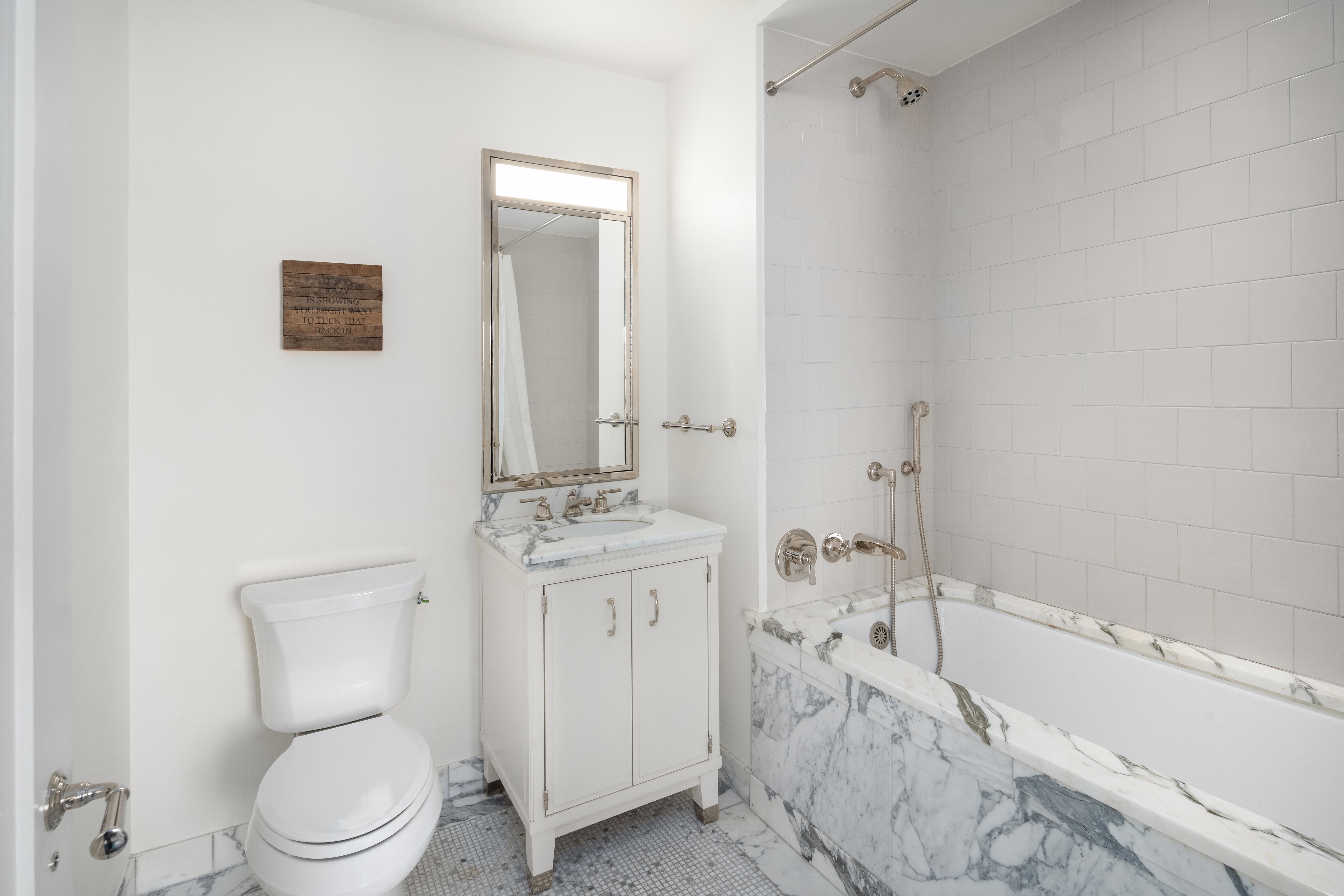 150 West 12th Street, Unit 11E Manhattan, NY 10011 - Photo 11 of 15 a bathroom with a toilet a sink and bathtub