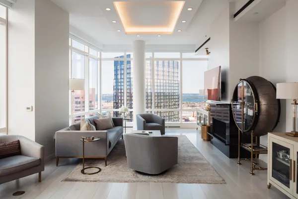 a living room with furniture and a large window