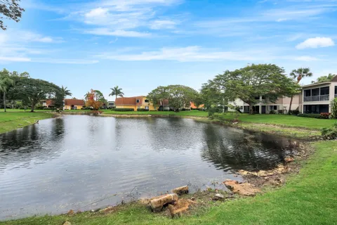 a view of a lake with houses in the back