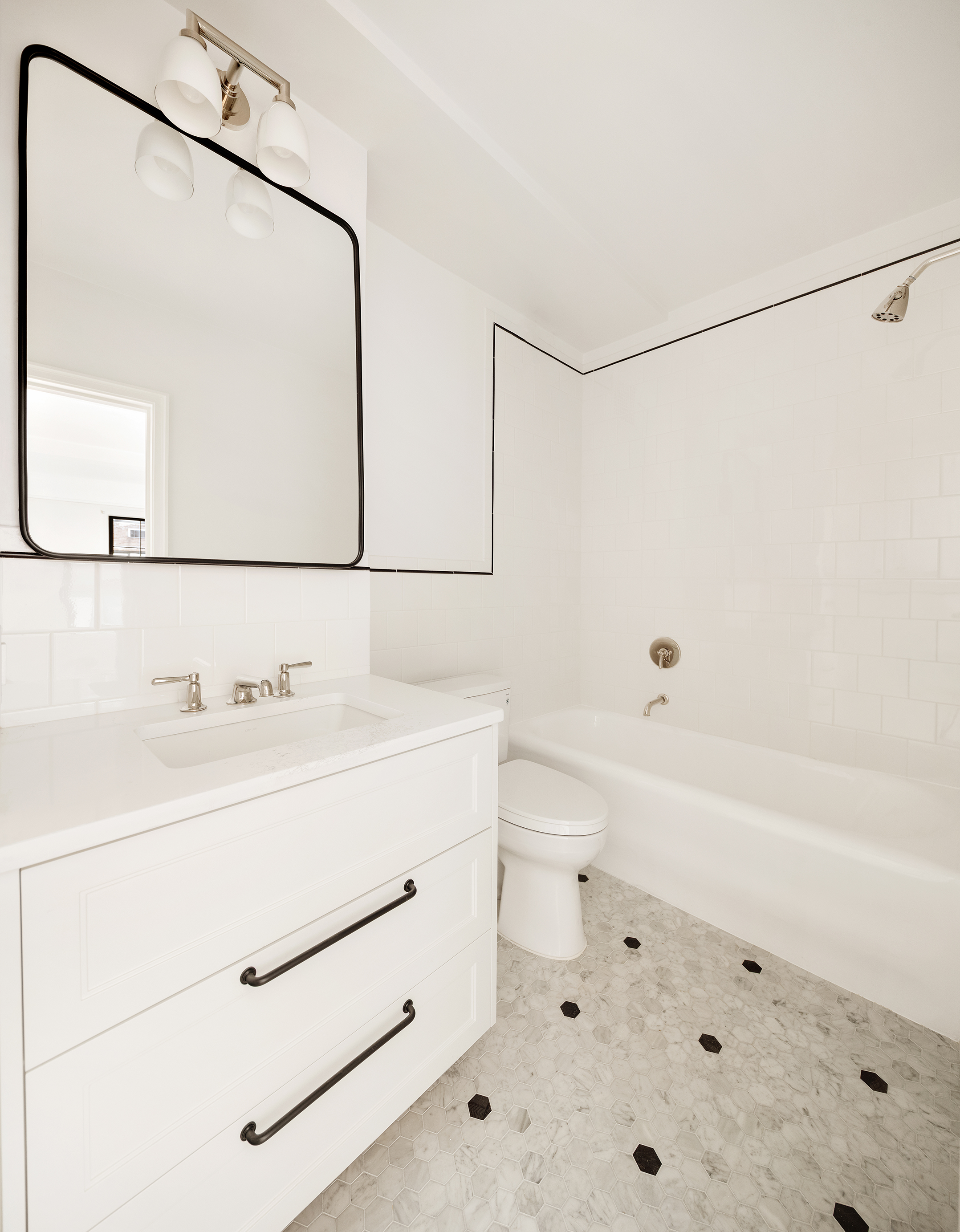 23 East 74th Street, Unit 10A Manhattan, NY 10021 - Photo 7 of 10 a bathroom with a sink and a mirror