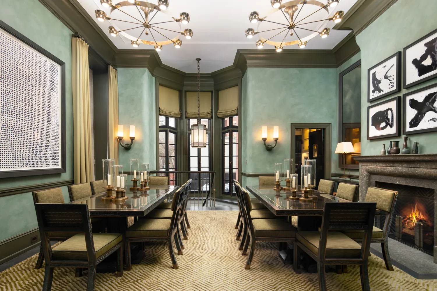 a view of a dining room with furniture and chandelier