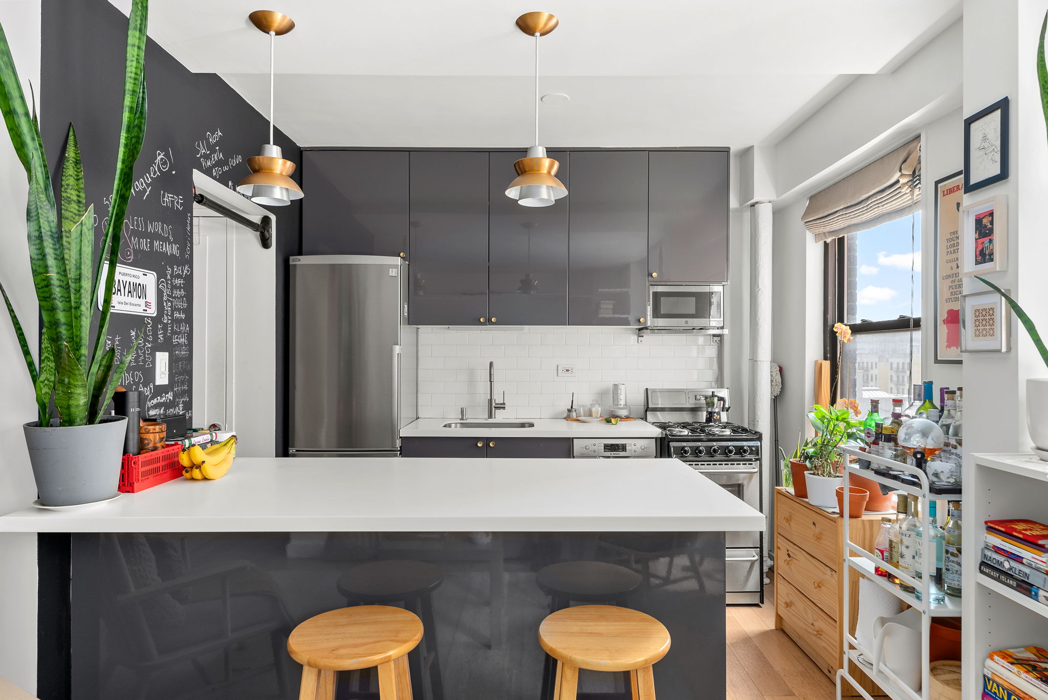 345 West 145th Street, Unit 11C2A Manhattan, NY 10031 - Photo 3 of 5 a bathroom with a sink a potted plant and a large mirror