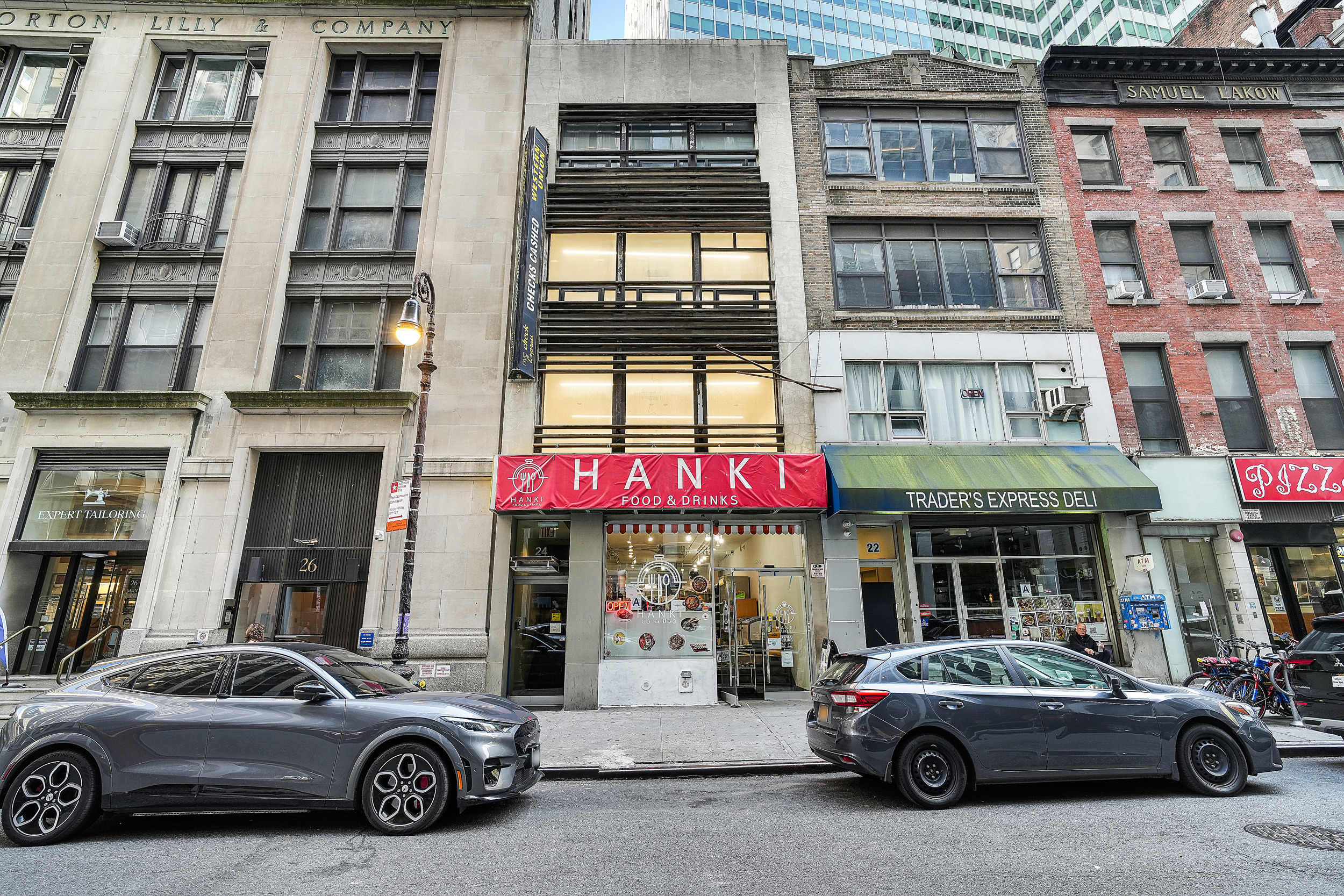 24 Beaver Street Manhattan, NY 10004 - Photo 1 of 25 a car parked in front of a building