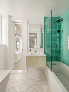 a bathroom with a sink a toilet and bathtub
