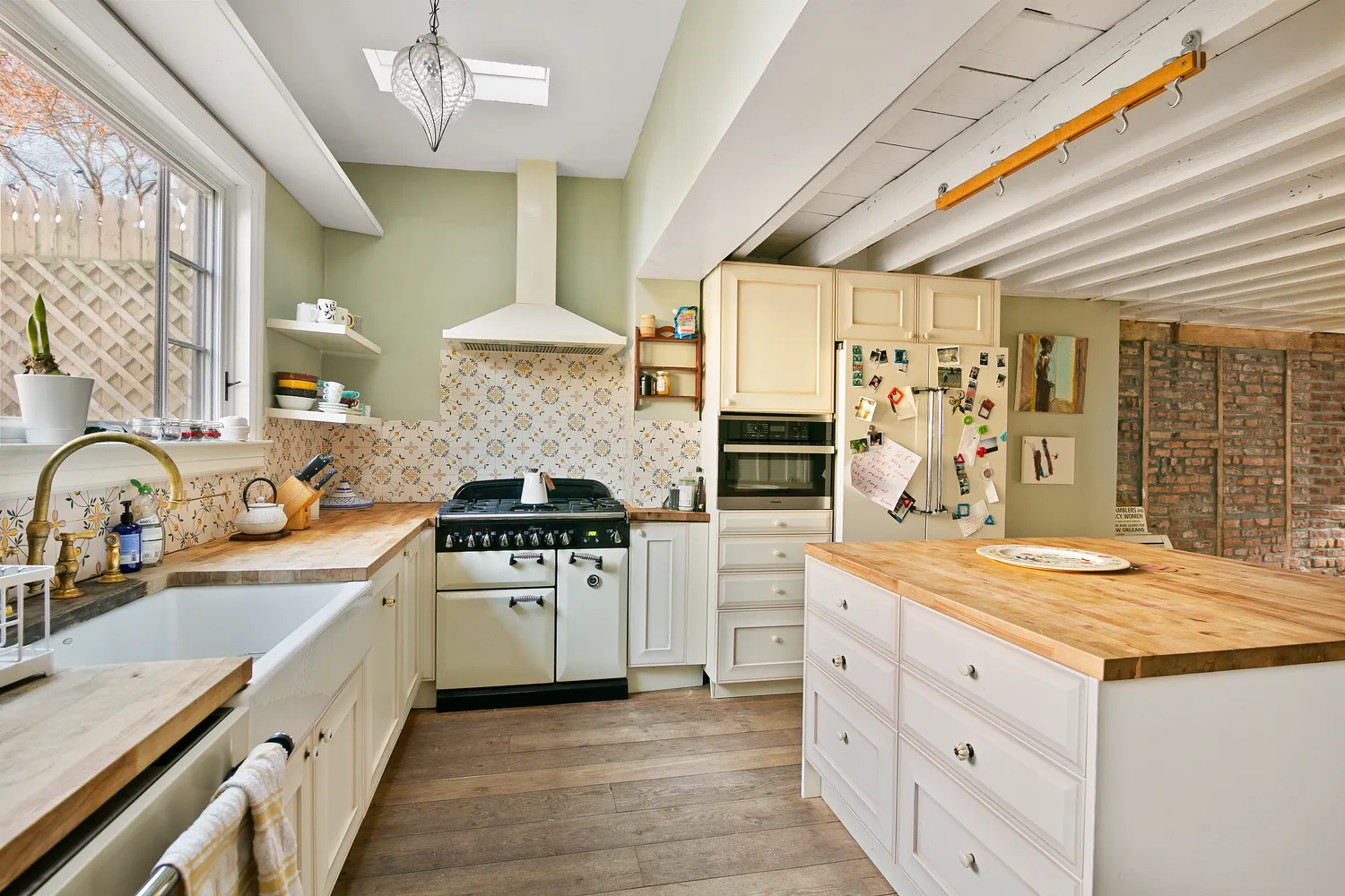 a kitchen with stainless steel appliances granite countertop a stove and a sink