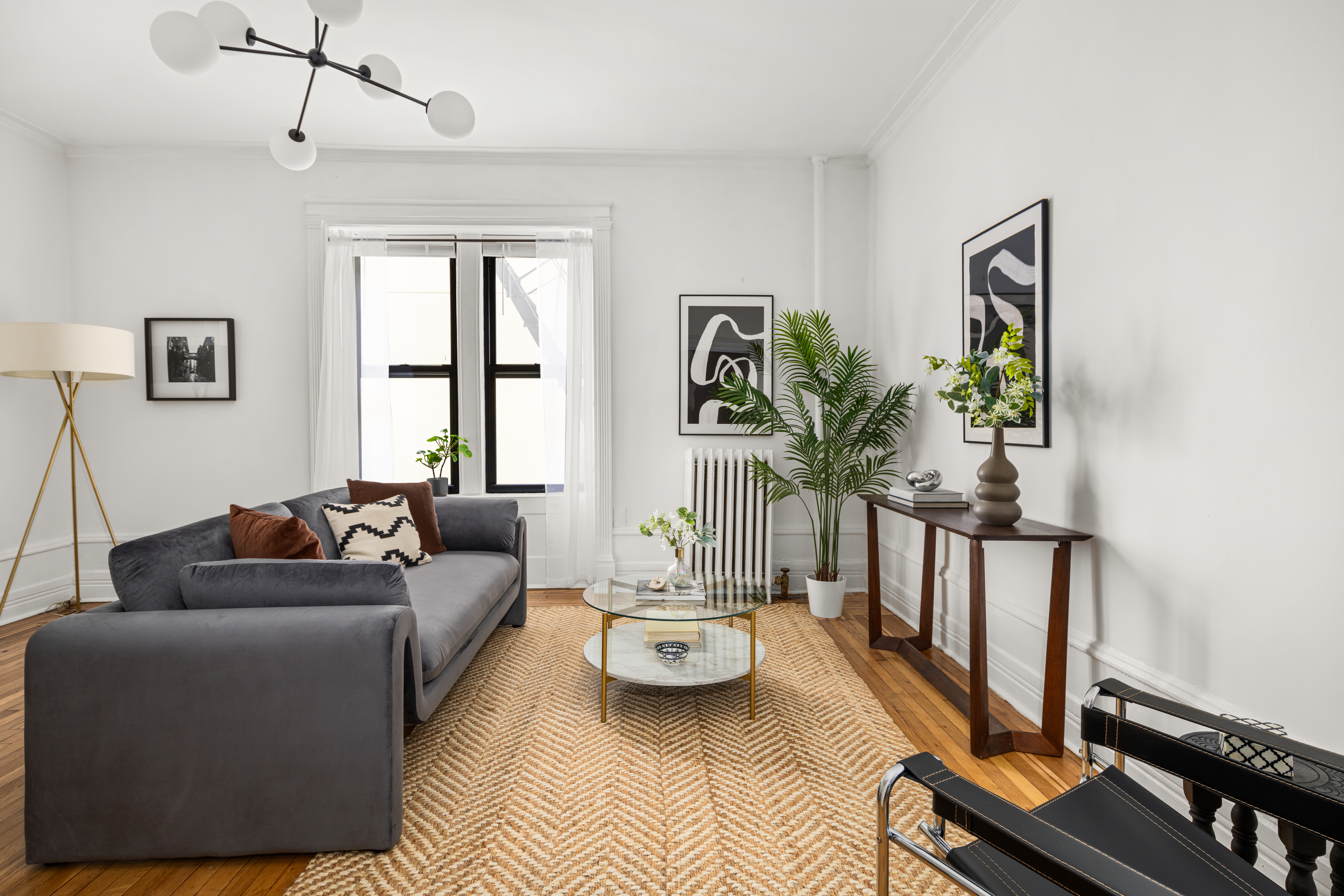 465 Eastern Parkway, Unit C Brooklyn, NY 11216 - Photo 3 of 12 a living room with furniture and a window