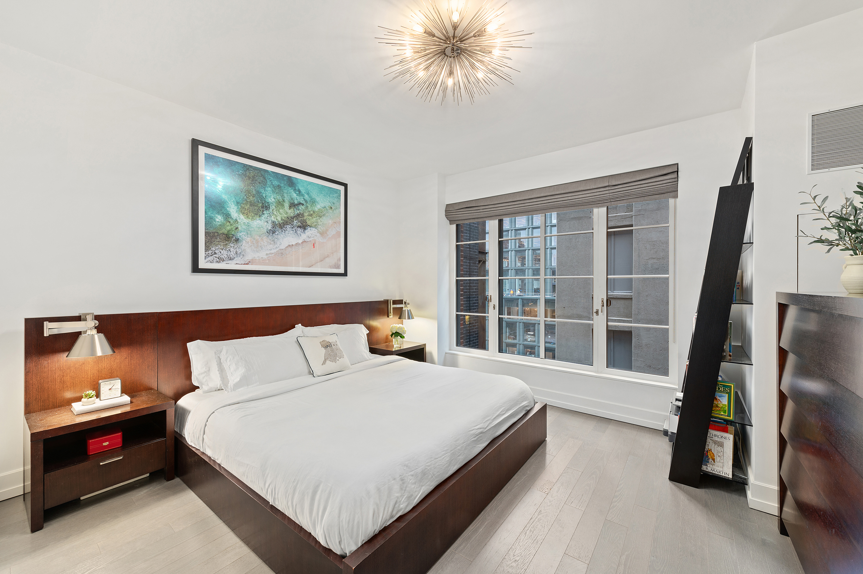 70 Charlton Street, Unit 16C Manhattan, NY 10014 - Photo 9 of 31 a bedroom with a bed and a large window