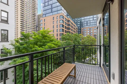 a view of a balcony with wooden floor