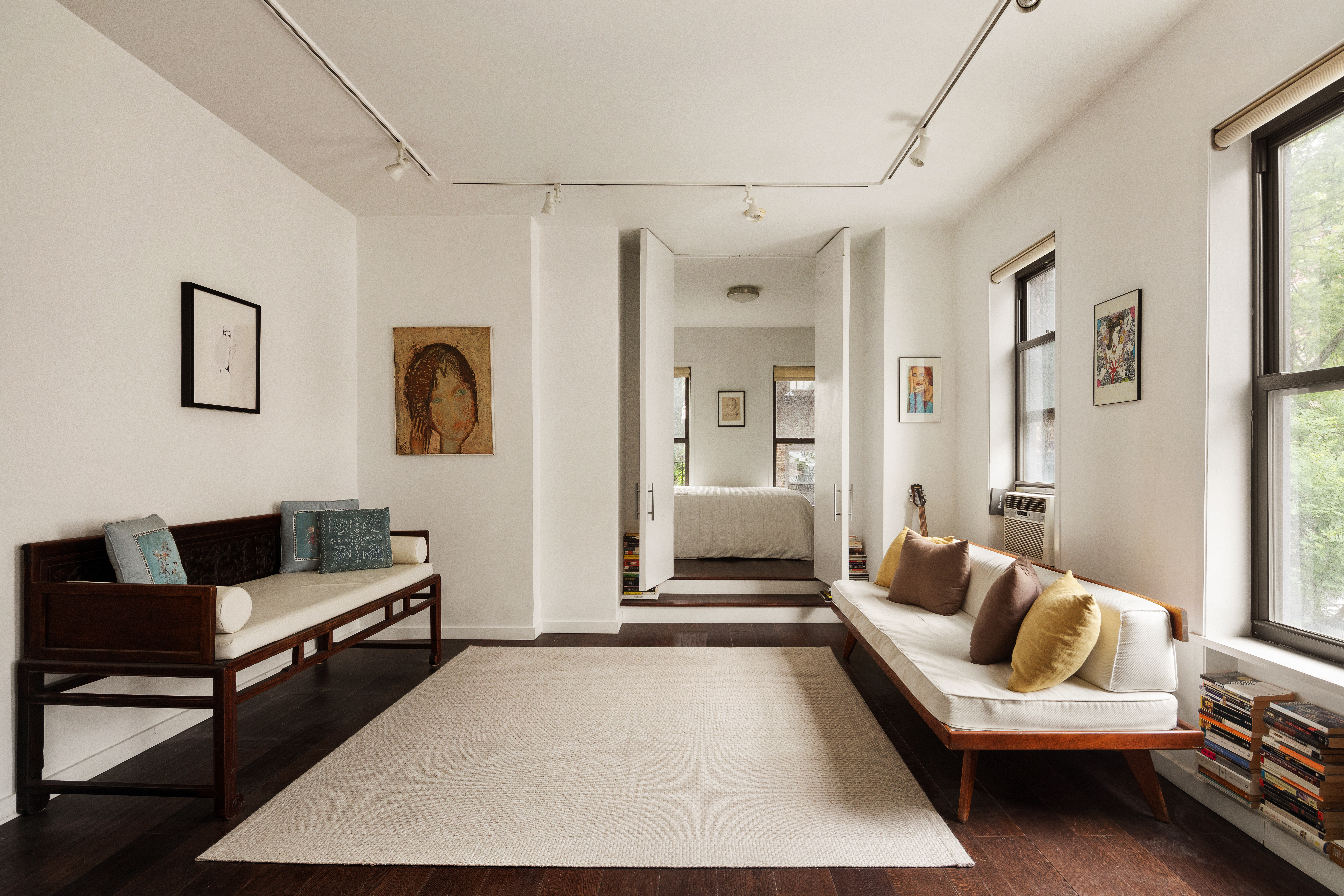 224 East 11th Street, Unit 19 Manhattan, NY 10003 - Photo 2 of 7 a living room with furniture and a rug