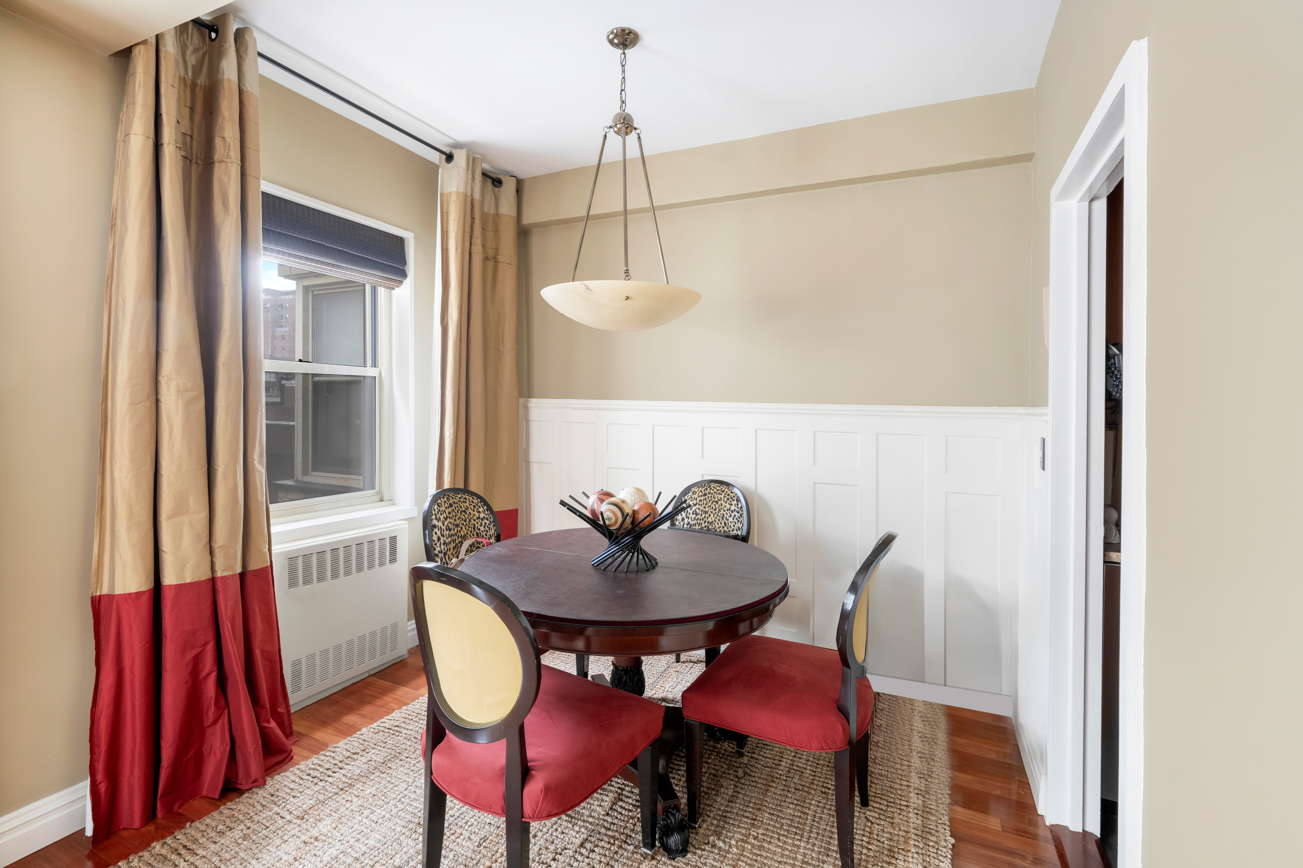 415 East 52nd Street, Unit 9BC Manhattan, NY 10022 - Photo 2 of 7 a view of a dining room with furniture and window