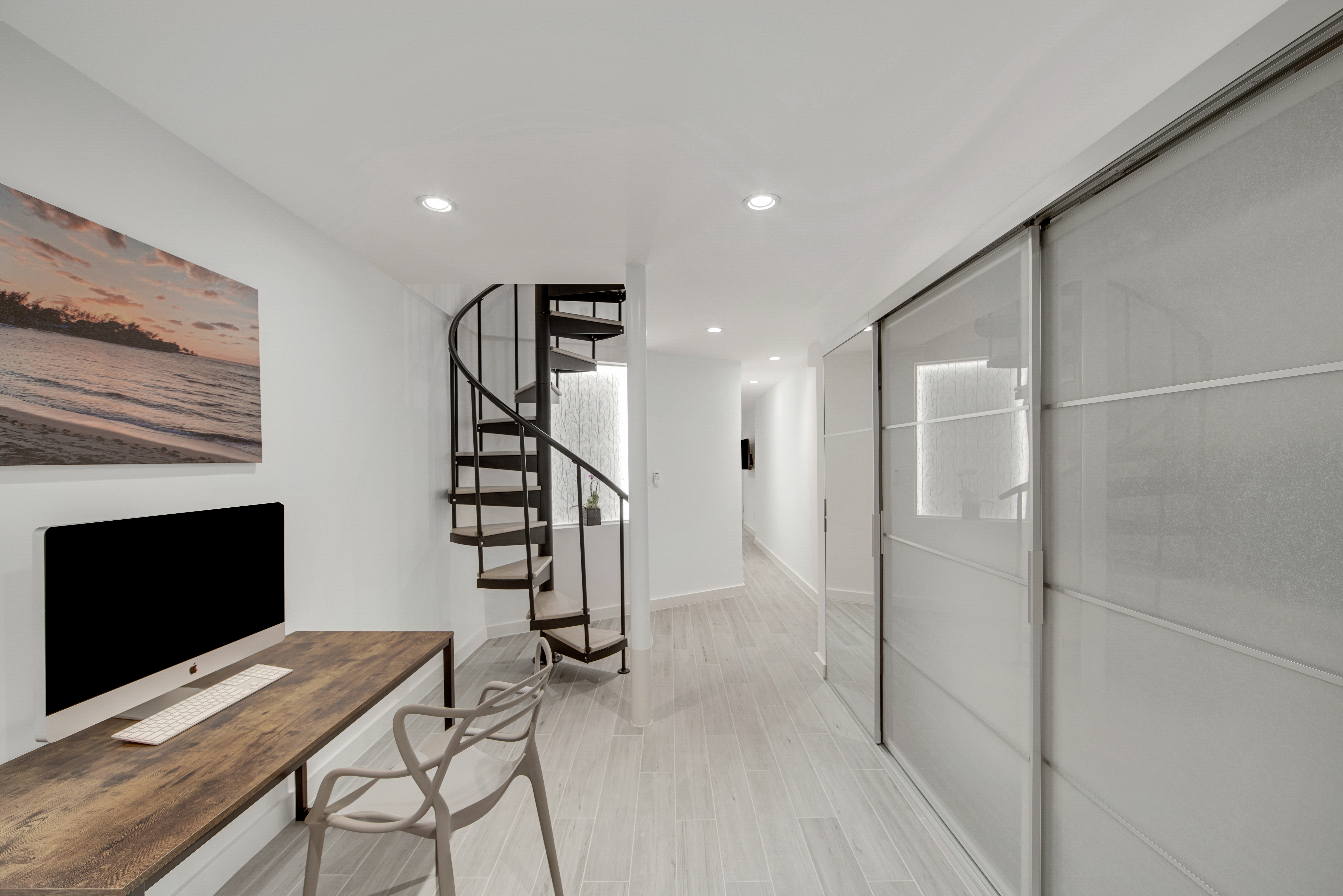 214 West 16th Street, Unit 1W Manhattan, NY 10011 - Photo 9 of 13 a view of a livingroom with furniture and staircase