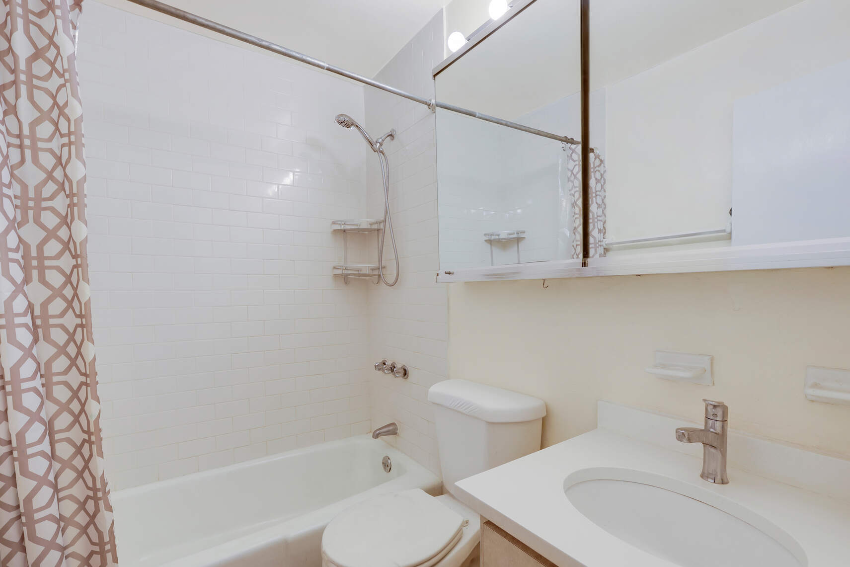 310 East 23rd Street, Unit 5A Manhattan, NY 10010 - Photo 8 of 14 a bathroom with a sink toilet and shower
