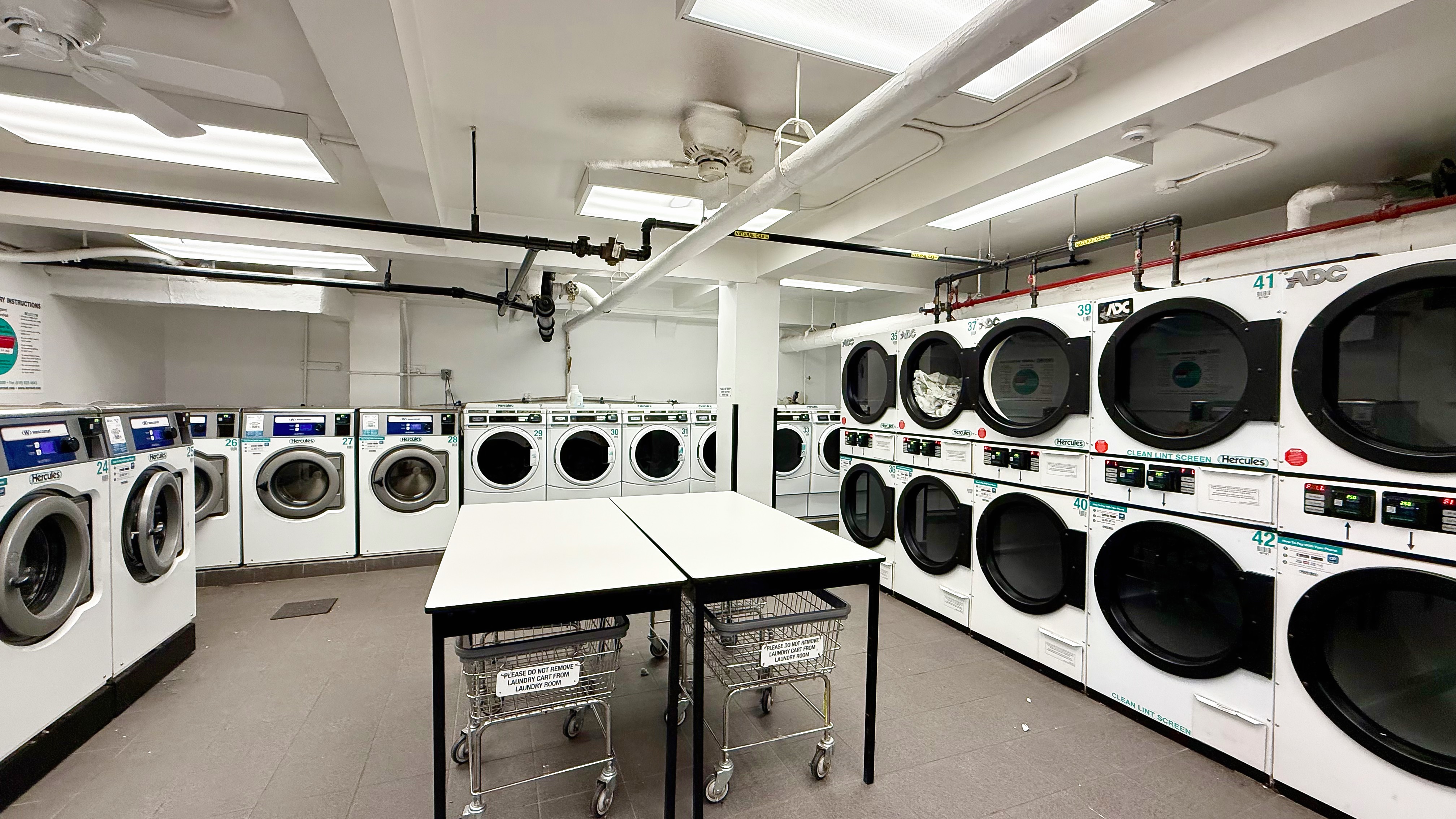 420 East 64th Street, Unit W4D Manhattan, NY 10065 - Photo 13 of 19 a utility room with dryer washer and dryer