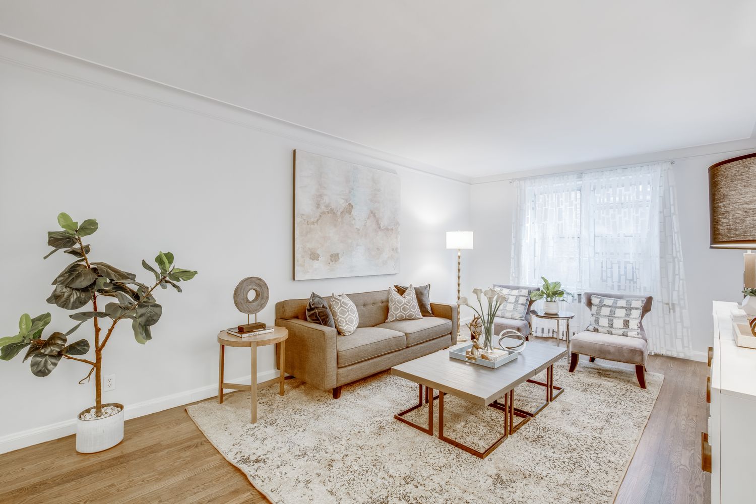 300 West 53rd Street, Unit 3C Manhattan, NY 10019 - Photo 2 of 10 a living room with furniture and wooden floor