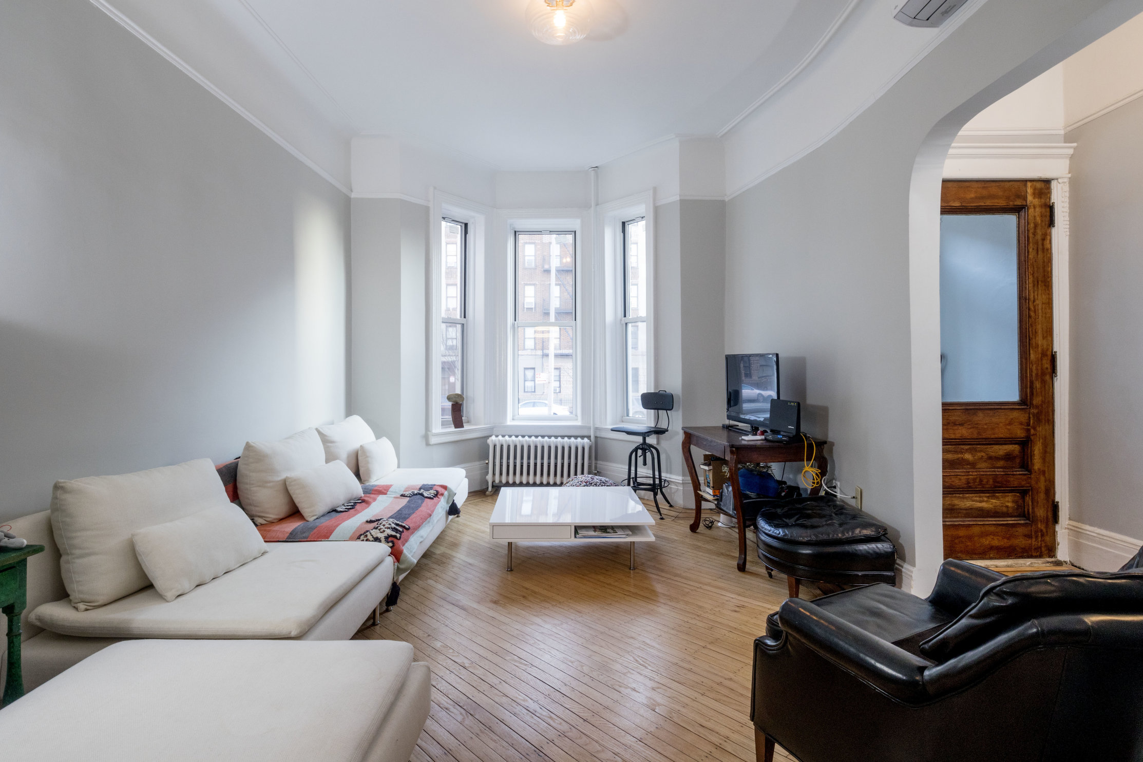 285 Empire Boulevard Brooklyn, NY 11225 - Photo 1 of 18 a living room with furniture and a wooden floor