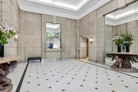 a bedroom with a bed and a potted plant