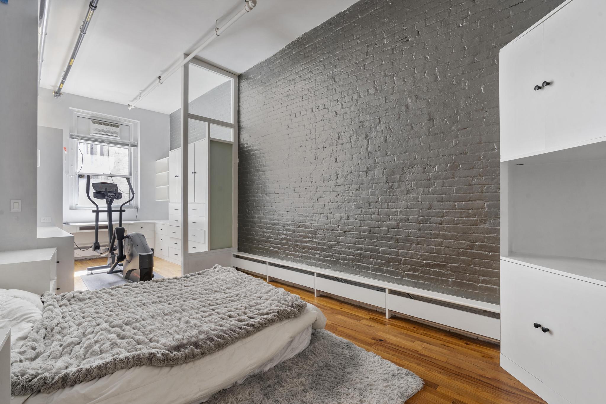 363 Greenwich Street, Unit 3C Manhattan, NY 10013 - Photo 6 of 11 a bathroom with a granite countertop sink and a mirror